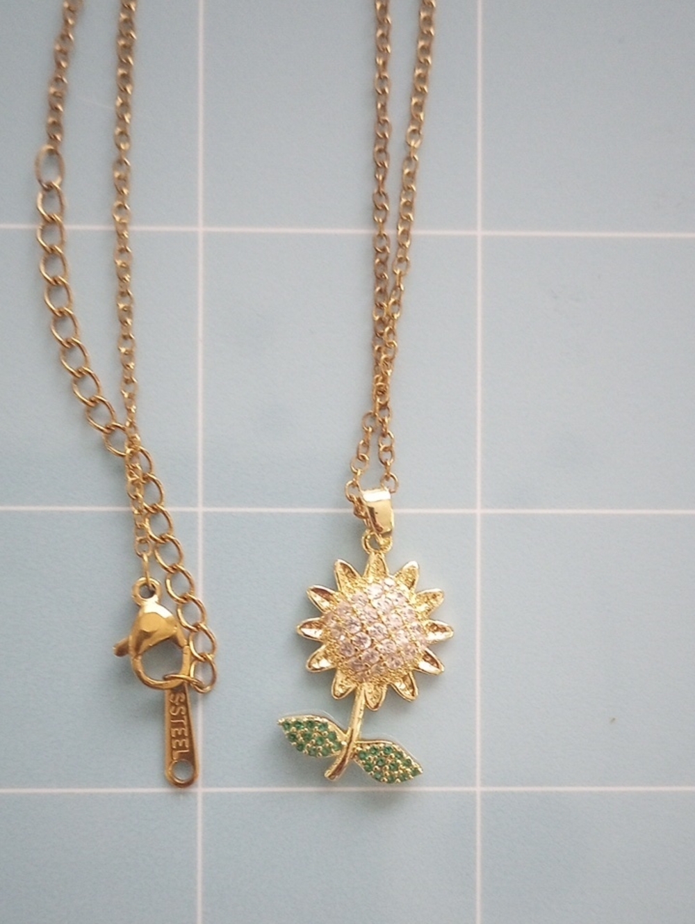 Golden Sunflower Rhinestone Pendant Necklace with Green Leaf Accents